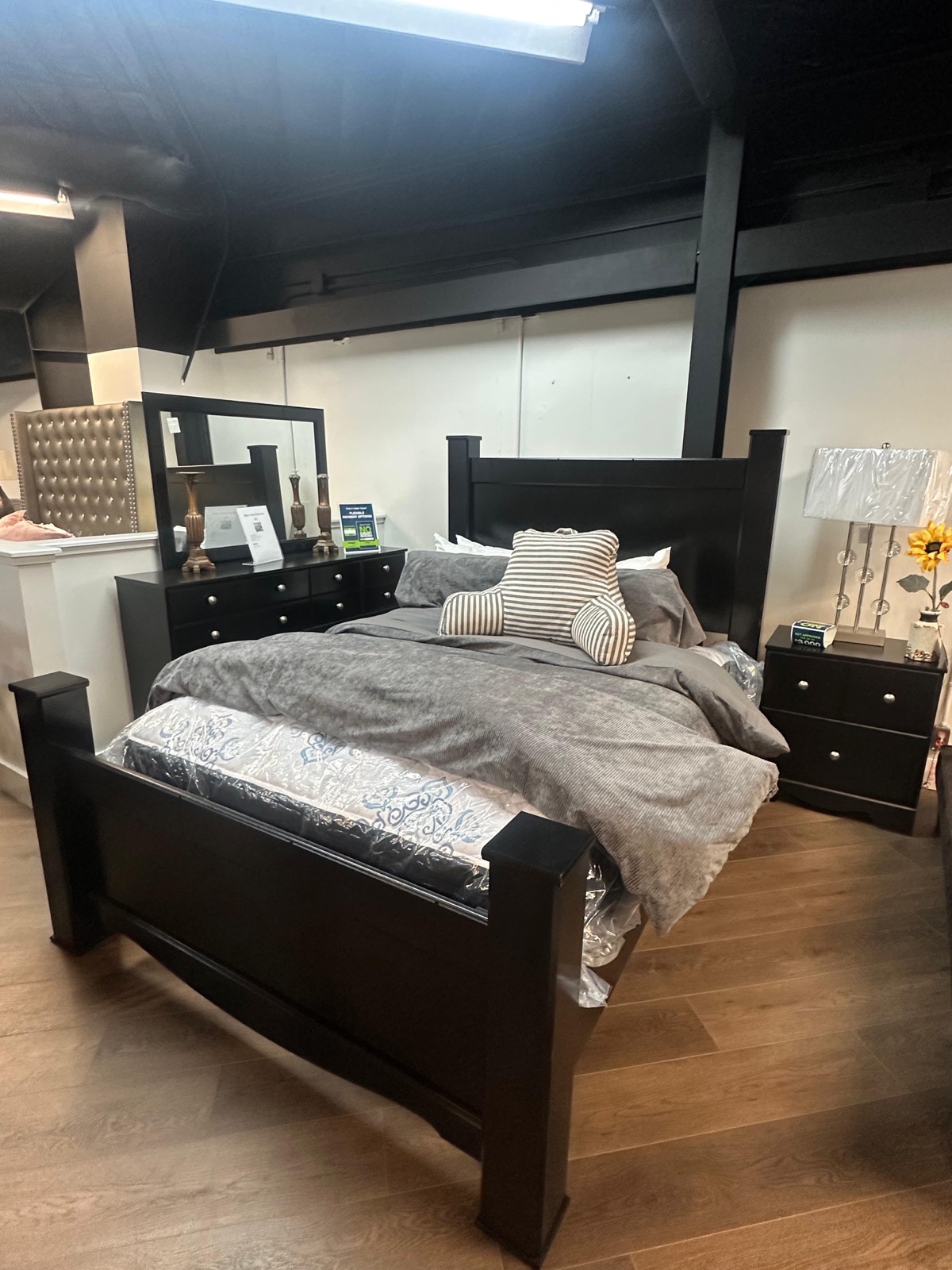Dark wood bedroom set with bed dresser and nightstand at Metropolitan Market and Decor Houston