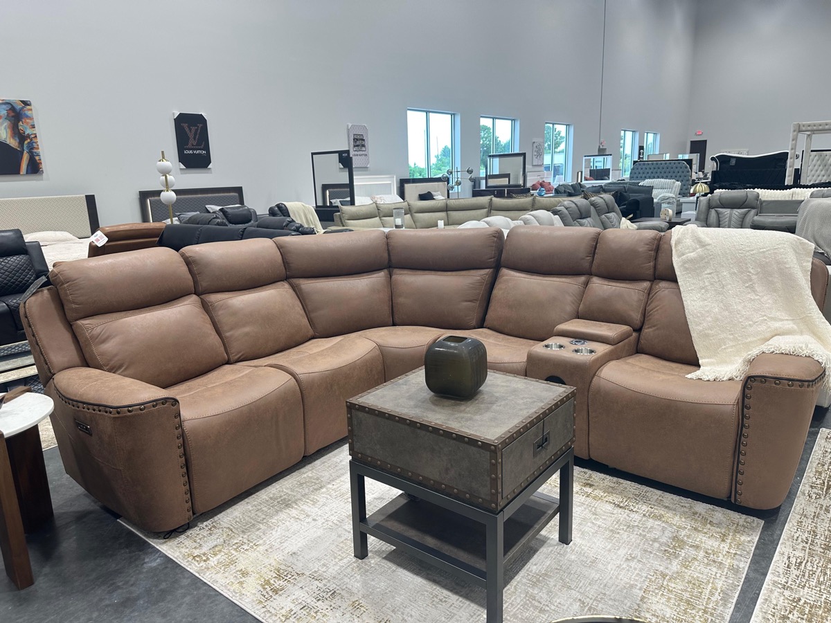 Brown leather reclining sectional with cup holders