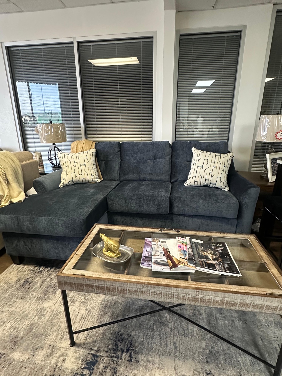 Teal blue sofa with reversible chaise and rustic coffee table